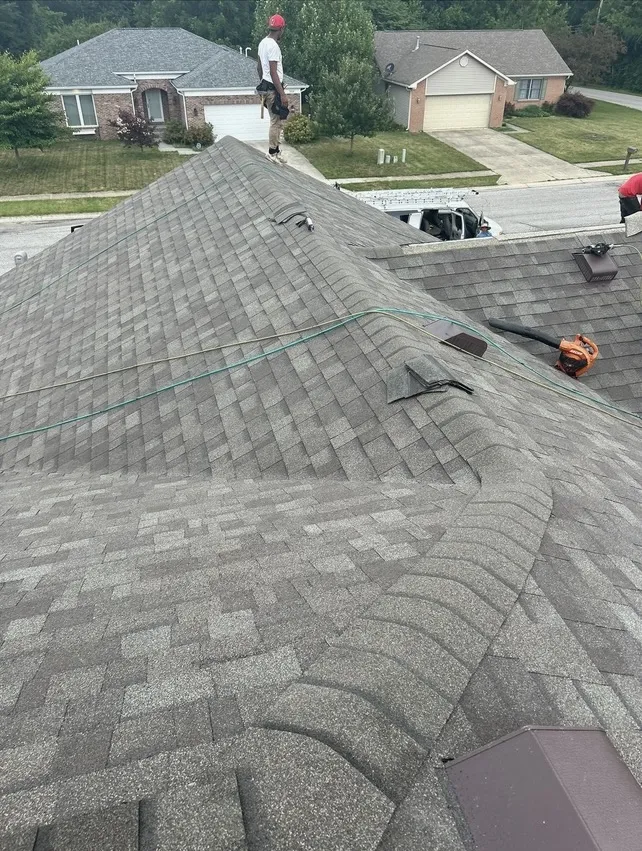 MM Contractors assessing a roofing project and preparing a quote in Indianapolis